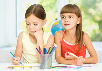 Image showing Little girls are drawing using pencils