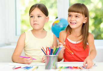 Image showing Little girls are drawing using pencils