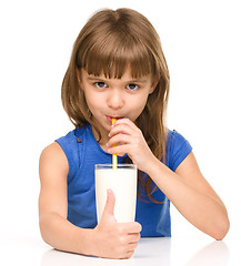 Image showing Cute little girl with a glass of milk