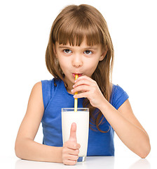 Image showing Cute little girl with a glass of milk