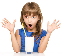 Image showing Cute little girl with a glass of milk