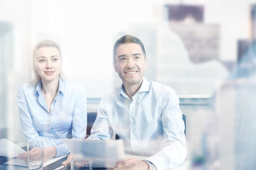 Image showing group of smiling businesspeople meeting in office