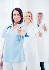 Image showing team of doctors showing thumbs up