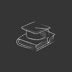 Image showing Graduation cap laying on book. Drawn in chalk icon.