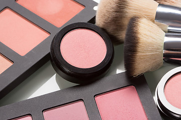 Image showing make-up cosmetics. compact powder, mineral foundation and makeup brushes