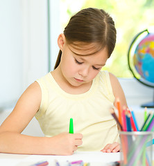 Image showing Cute cheerful child drawing using felt-tip pen