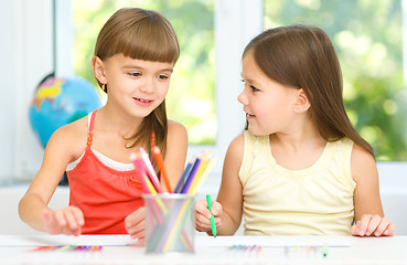 Image showing Little girls are drawing using pencils