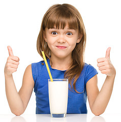 Image showing Cute little girl with a glass of milk