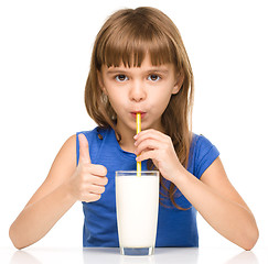 Image showing Cute little girl with a glass of milk