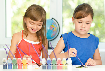 Image showing Little girls are drawing using pencils