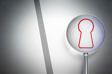 Image showing Safety concept:  Keyhole with optical glass on digital background