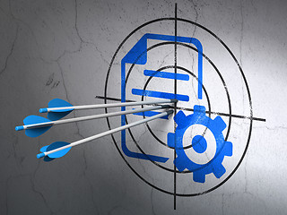 Image showing Software concept: arrows in Gear target on wall background