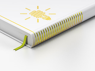 Image showing Finance concept: closed book, Energy Saving Lamp on white background