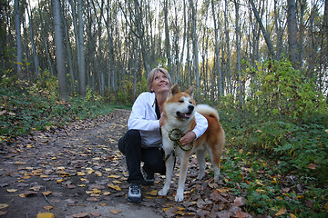 Image showing Lady with her dog