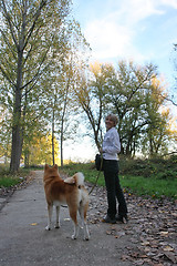 Image showing Lady with her dog