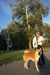 Image showing Lady with her dog