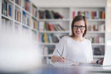 Image showing female student study in school library