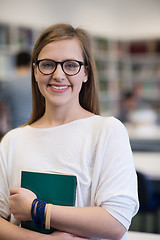 Image showing portrait of female student in library