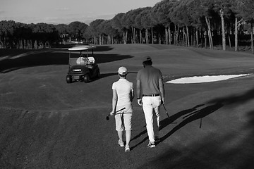 Image showing couple walking on golf course