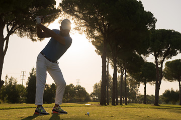 Image showing golf player hitting shot