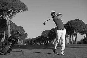 Image showing golf player hitting shot