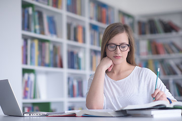 Image showing female student study in school library