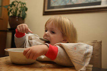 Image showing Young girl eating