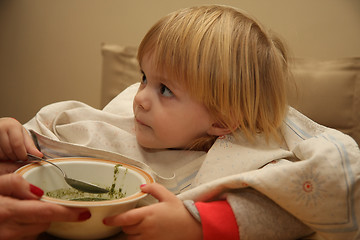 Image showing Young girl eating