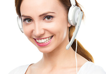 Image showing Lovely young woman is talking to customers