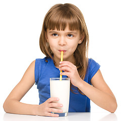 Image showing Cute little girl with a glass of milk