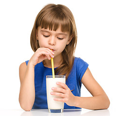 Image showing Cute little girl with a glass of milk