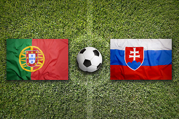 Image showing Portugal vs. Slovakia flags on soccer field