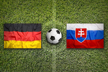 Image showing Germany vs. Slovakia flags on soccer field