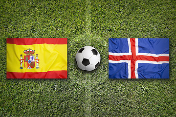 Image showing Spain vs. Iceland flags on soccer field