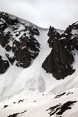 Image showing Rocks with snow cornices and traces from avalanches