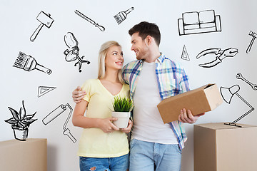 Image showing smiling couple with big boxes moving to new home