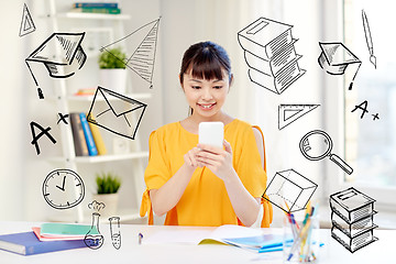 Image showing happy young woman student with smartphone at home