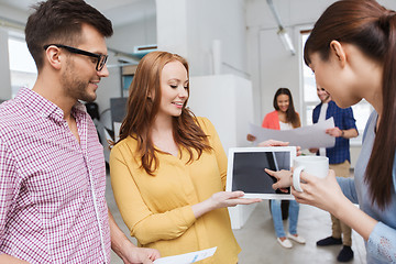 Image showing creative team with tablet pc talking at office