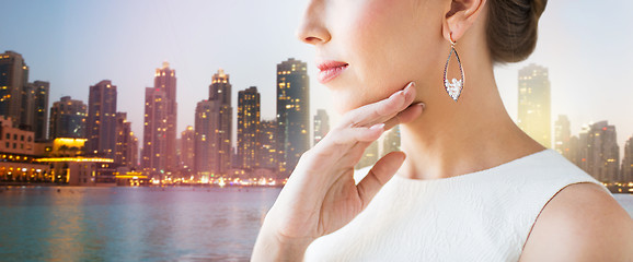 Image showing close up of beautiful woman face with earrings