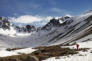 Image showing Hiker at snowy mountains in evening