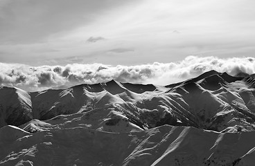 Image showing Black and white evening snowy mountains