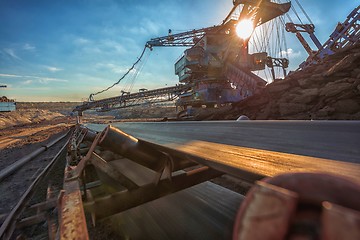 Image showing Long conveyor belt transporting ore