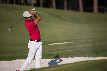 Image showing golfer hitting a sand bunker shot