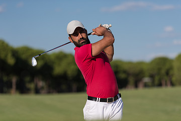 Image showing golfer hitting a sand bunker shot