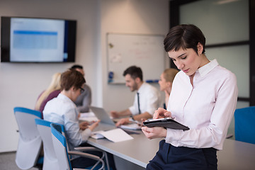 Image showing business woman on meeting  using tablet