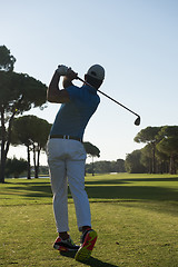 Image showing golf player hitting shot