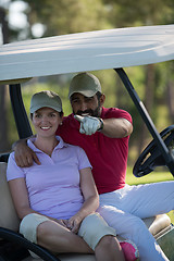 Image showing couple in buggy on golf course