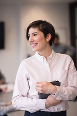 Image showing hispanic businesswoman with tablet at meeting room