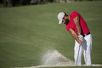 Image showing golfer hitting a sand bunker shot