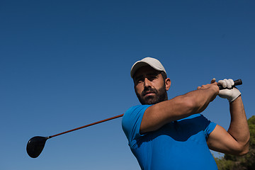 Image showing golf player hitting shot